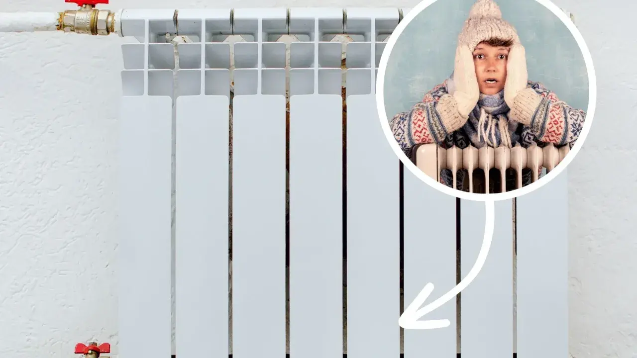 Chłopak w czapce i szaliku trzyma się za głowę, bo zimne grzejniki na dole nie grzeją.