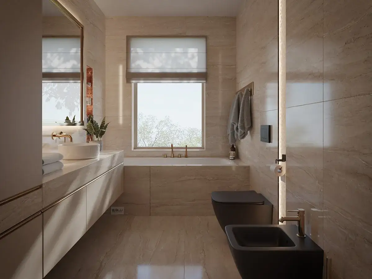 Elegancka, wąska łazienka z oknem na końcu. Wanna, czarna miska WC i bidet, umywalka nablatowa, lustro.