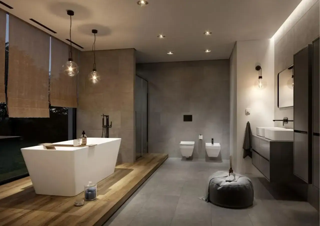 Nowoczesna łazienka w stylu spa z wolnostojącą wanną, prysznicem, dwiema miskami WC i umywalkami.